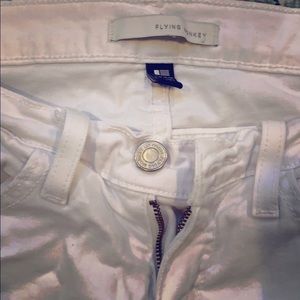 Women’s distressed white jeans